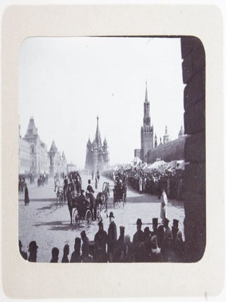 [RUSSIA - MOSCOW] [Album with Fifty Original Gelatin Silver Photographs of Pre-Revolutionary Tsarist Moscow, Showing the Now-Destroyed Sukharev Tower and Alexander II Monument, Tsar Bell & Canon, Saint Basil's Cathedral, Morozov Mansion, St. Clement&rsquo;s Church, Kremlin Tower, etc.; Individual and Group Portraits of Monk Beggars, Grenadiers, Cossacks, Police Officers, and Troika Drivers, and Scenes from Easter Bazaar, Parade, etc.; also, with the Photos of the Trinity Lavra of St. Sergius in Sergiyev Posad and the Now-Destroyed Gethsemane Chernigov Skete]