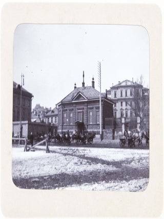 [RUSSIA - MOSCOW] [Album with Fifty Original Gelatin Silver Photographs of Pre-Revolutionary Tsarist Moscow, Showing the Now-Destroyed Sukharev Tower and Alexander II Monument, Tsar Bell & Canon, Saint Basil's Cathedral, Morozov Mansion, St. Clement&rsquo;s Church, Kremlin Tower, etc.; Individual and Group Portraits of Monk Beggars, Grenadiers, Cossacks, Police Officers, and Troika Drivers, and Scenes from Easter Bazaar, Parade, etc.; also, with the Photos of the Trinity Lavra of St. Sergius in Sergiyev Posad and the Now-Destroyed Gethsemane Chernigov Skete]
