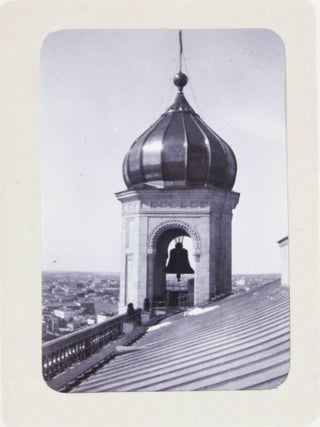 [RUSSIA - MOSCOW] [Album with Fifty Original Gelatin Silver Photographs of Pre-Revolutionary Tsarist Moscow, Showing the Now-Destroyed Sukharev Tower and Alexander II Monument, Tsar Bell & Canon, Saint Basil's Cathedral, Morozov Mansion, St. Clement&rsquo;s Church, Kremlin Tower, etc.; Individual and Group Portraits of Monk Beggars, Grenadiers, Cossacks, Police Officers, and Troika Drivers, and Scenes from Easter Bazaar, Parade, etc.; also, with the Photos of the Trinity Lavra of St. Sergius in Sergiyev Posad and the Now-Destroyed Gethsemane Chernigov Skete]