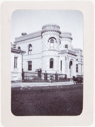 [RUSSIA - MOSCOW] [Album with Fifty Original Gelatin Silver Photographs of Pre-Revolutionary Tsarist Moscow, Showing the Now-Destroyed Sukharev Tower and Alexander II Monument, Tsar Bell & Canon, Saint Basil's Cathedral, Morozov Mansion, St. Clement&rsquo;s Church, Kremlin Tower, etc.; Individual and Group Portraits of Monk Beggars, Grenadiers, Cossacks, Police Officers, and Troika Drivers, and Scenes from Easter Bazaar, Parade, etc.; also, with the Photos of the Trinity Lavra of St. Sergius in Sergiyev Posad and the Now-Destroyed Gethsemane Chernigov Skete]