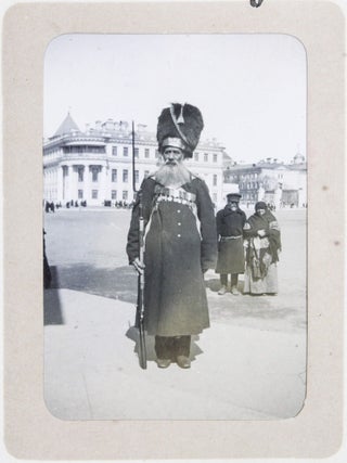 [RUSSIA - MOSCOW] [Album with Fifty Original Gelatin Silver Photographs of Pre-Revolutionary Tsarist Moscow, Showing the Now-Destroyed Sukharev Tower and Alexander II Monument, Tsar Bell & Canon, Saint Basil's Cathedral, Morozov Mansion, St. Clement&rsquo;s Church, Kremlin Tower, etc.; Individual and Group Portraits of Monk Beggars, Grenadiers, Cossacks, Police Officers, and Troika Drivers, and Scenes from Easter Bazaar, Parade, etc.; also, with the Photos of the Trinity Lavra of St. Sergius in Sergiyev Posad and the Now-Destroyed Gethsemane Chernigov Skete]