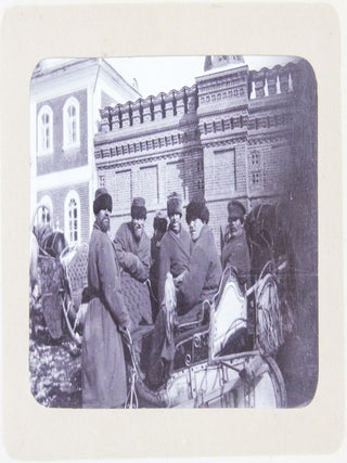 [RUSSIA - MOSCOW] [Album with Fifty Original Gelatin Silver Photographs of Pre-Revolutionary Tsarist Moscow, Showing the Now-Destroyed Sukharev Tower and Alexander II Monument, Tsar Bell & Canon, Saint Basil's Cathedral, Morozov Mansion, St. Clement&rsquo;s Church, Kremlin Tower, etc.; Individual and Group Portraits of Monk Beggars, Grenadiers, Cossacks, Police Officers, and Troika Drivers, and Scenes from Easter Bazaar, Parade, etc.; also, with the Photos of the Trinity Lavra of St. Sergius in Sergiyev Posad and the Now-Destroyed Gethsemane Chernigov Skete]